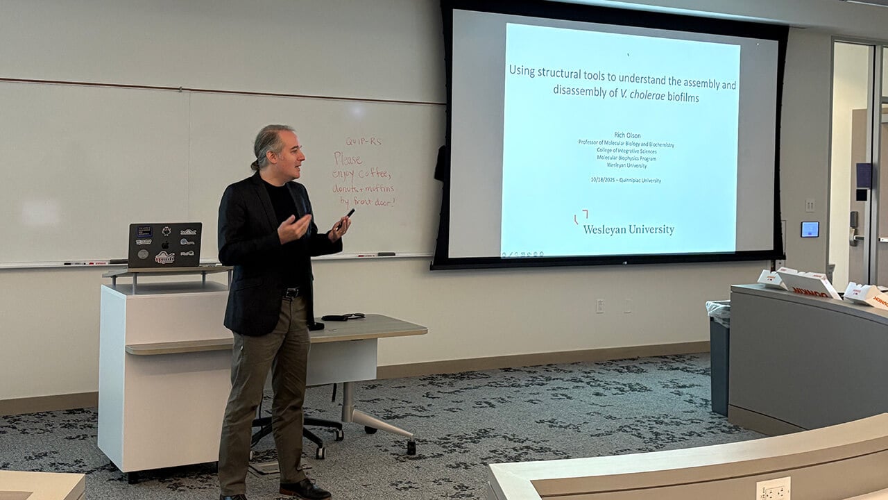 A man giving a presentation to a class