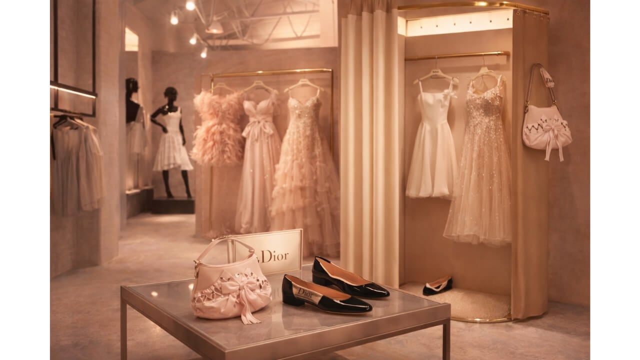 AI mockup of fitting room with various dresses, bags, and ballet flats on display