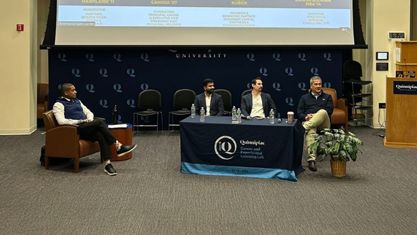 Alumni and top consulting pros share insights with students in a panel-discussion format.