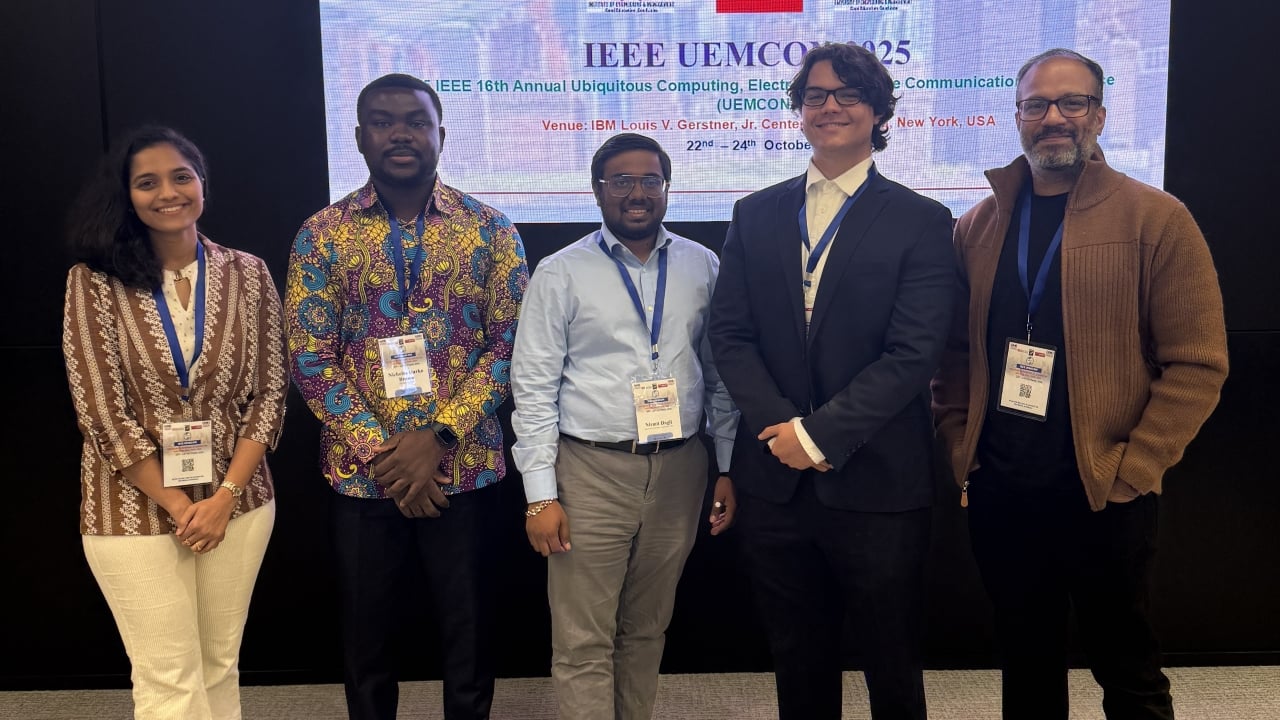 Group of student researchers and academic researchers attending a conference